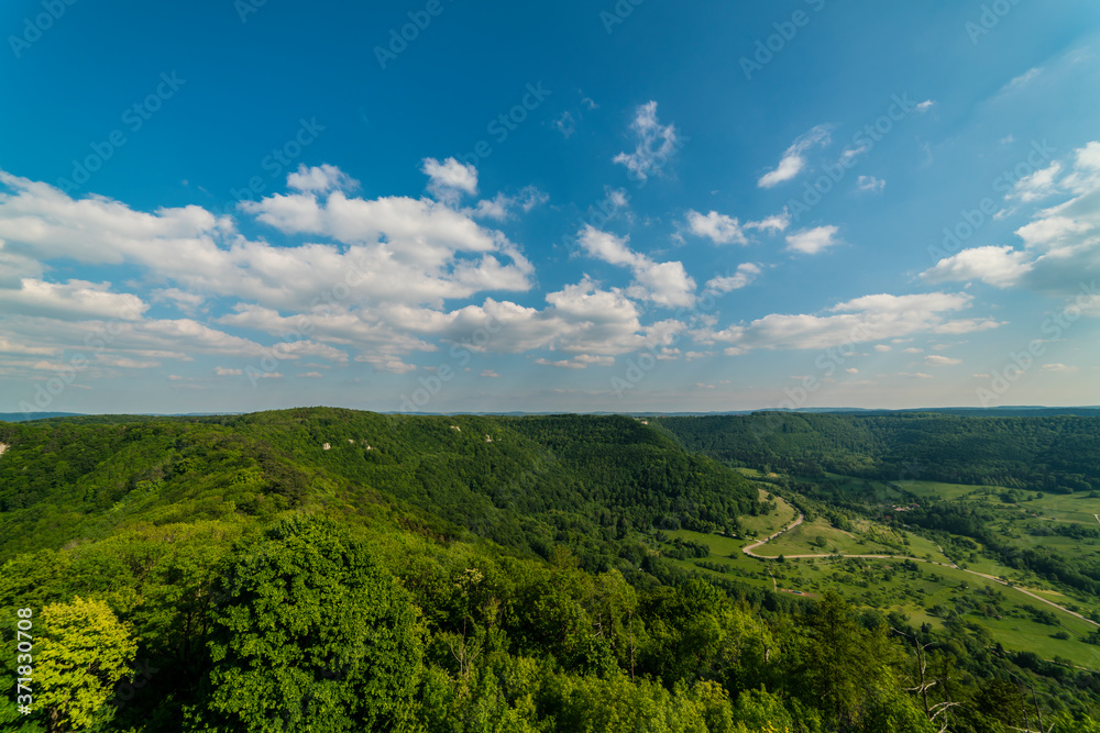 Germany, Aerial scenic view above green valleys of swabian alb nature landscape from hohenneuffen mountain on sunny day in summer