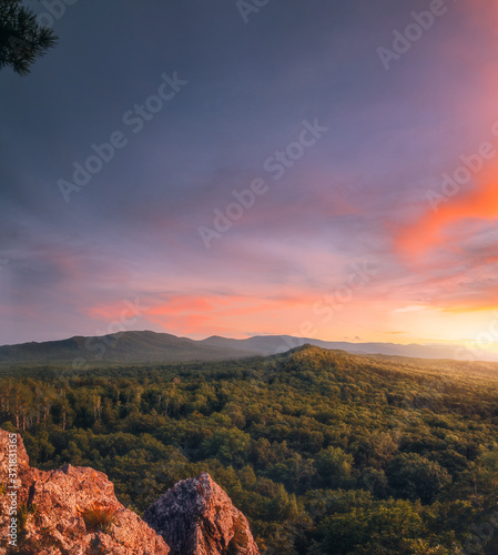 Bolshekhekhtsirsky Nature Reserve. Khabarovsk region, far East, Russia. Beautiful and dramatic sunset from mountain.