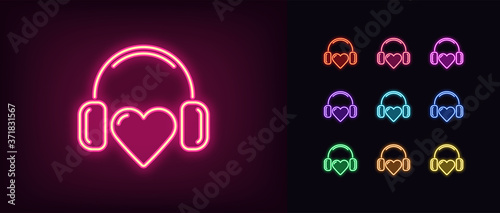Neon music heart icon. Glowing neon heart sign with headphones, heartbeat melody