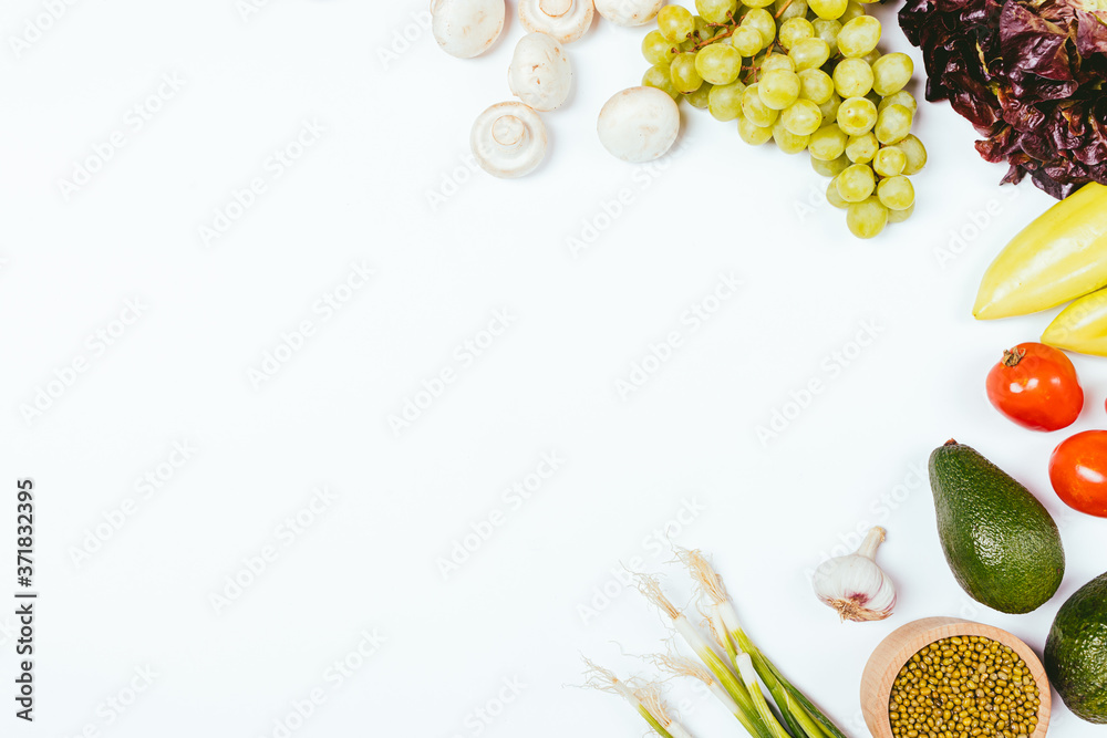 Clean eating background fresh vegetables and fruits on white table