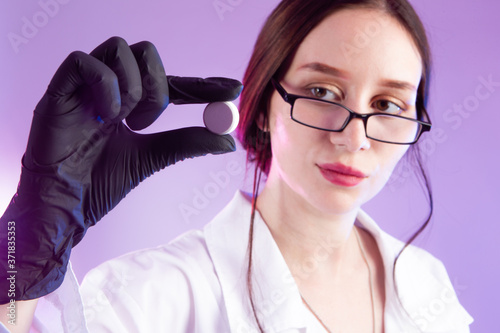 Vaccine. Virologist holds a...