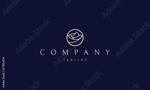 Vector logo on which an abstract image of a beautiful golden rose bud in a circle.