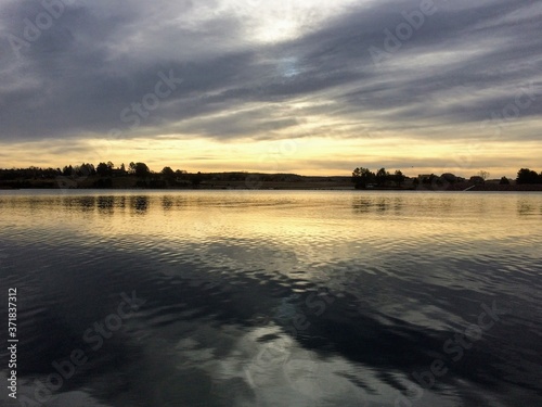 calm lake in the mountains at sunset © Jon