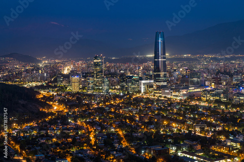 Panoramic view of Santiago cityscape at night, Chile, South America. photo
