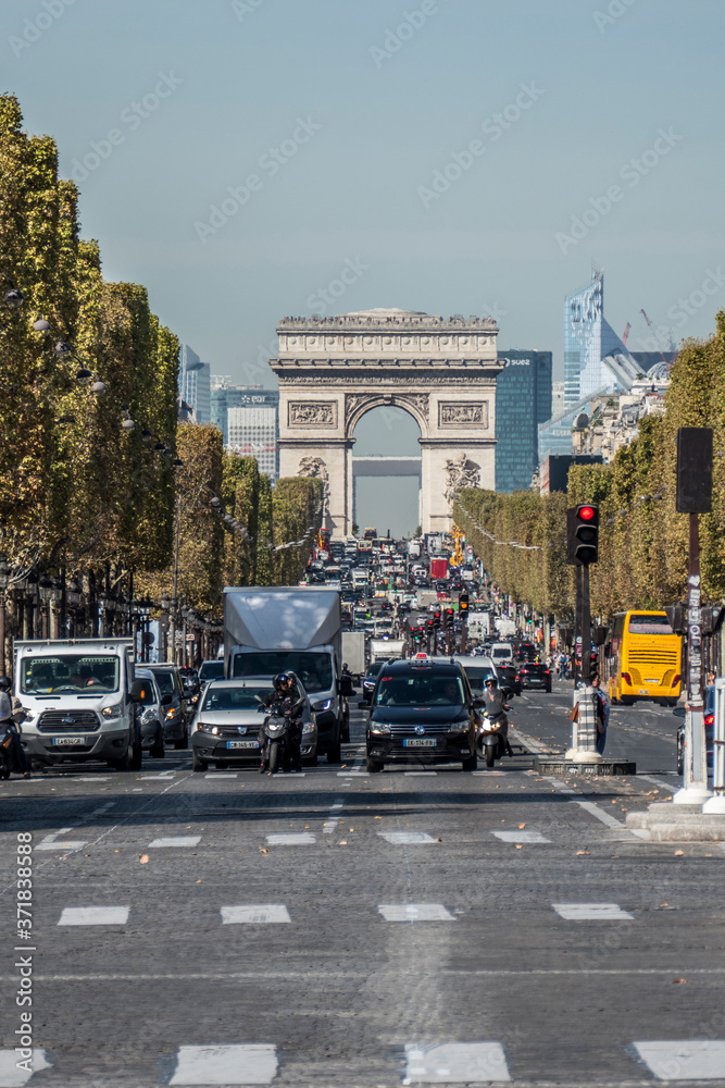 The road of the Champs Elysées in Paris with the Arch of Triumphe in background