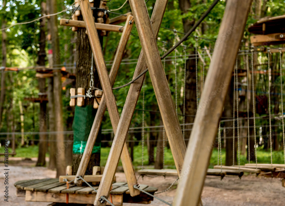Fototapeta premium Rope park in a forest. Adventure summer park.