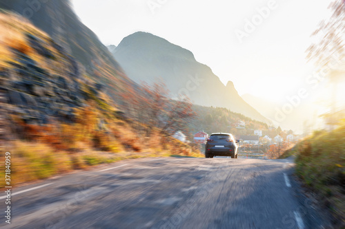 Car on a mountain road in autumn 