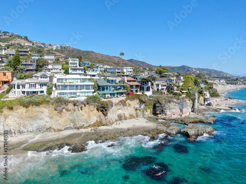 Aerial view of Laguna Beach coastline town with wealthy villas on the cliff, Southern California Coastline, USA