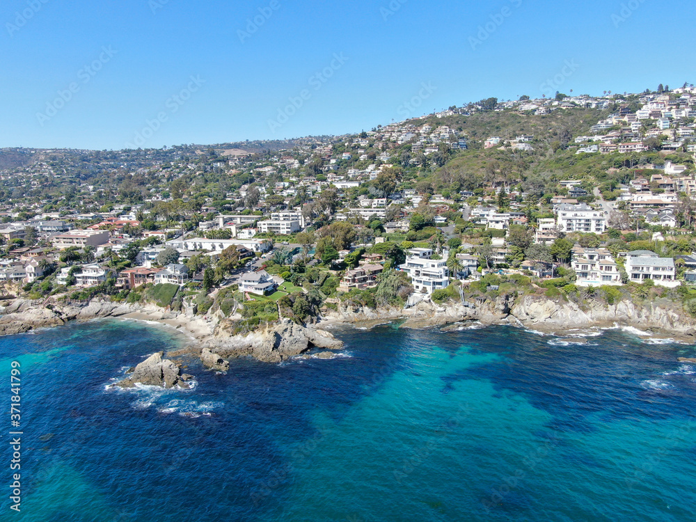Aerial view of Laguna Beach coastline town with wealthy villas on the cliff, Southern California Coastline, USA