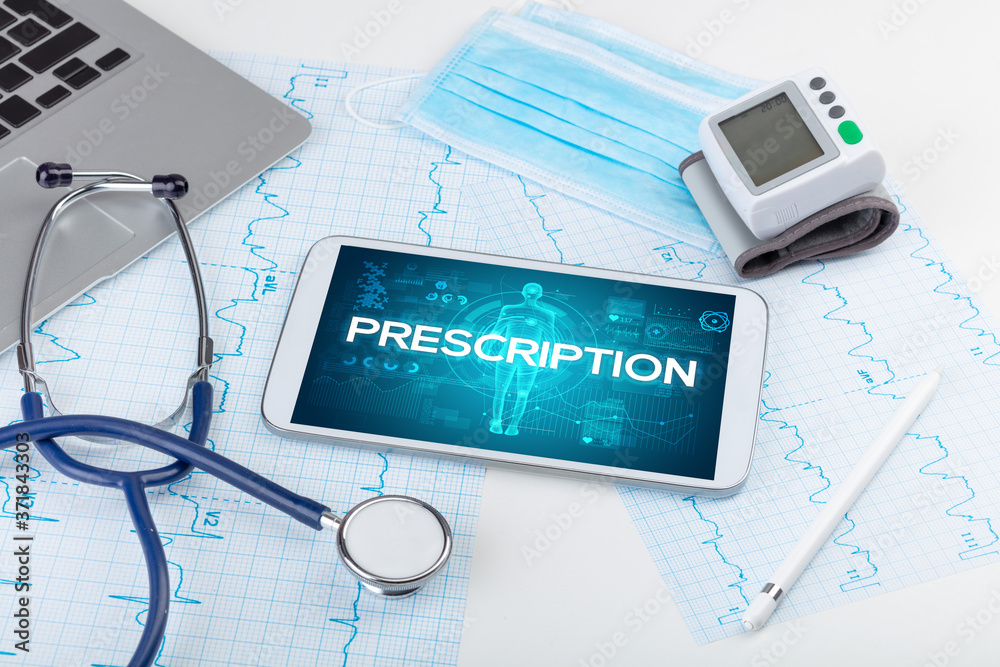 Tablet pc and doctor tools with PRESCRIPTION inscription, coronavirus concept Tablet pc and doctor tools with PRESCRIPTION inscription, coronavirus concept