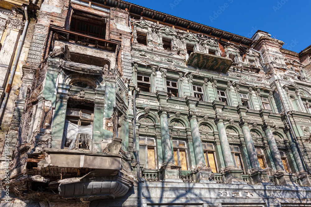 The mystical ruined facade of an old historical house from the early 18th century. Ukraine, Odessa