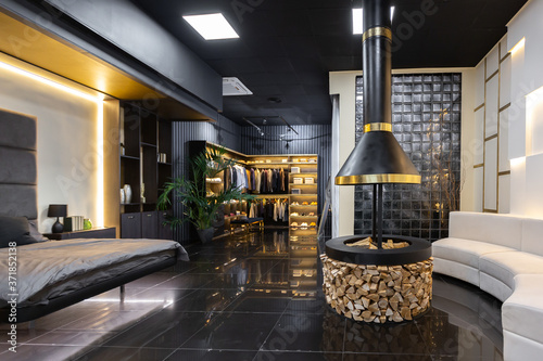 Fotografie dark modern stylish male apartment interior with lighting, decorative walls, fir