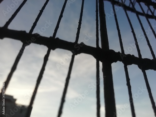 Cage view of sky at evening time