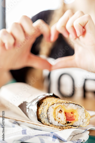 photos of dishes roll seafood heart with your hands in the cafe bright Sunny natural light