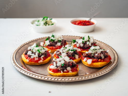 Sopes also known as Picadita  Traditional Mexican Dish Originating in the central and southern parts of Mexico That Looks like an Unusually Thick Tortilla with Toppings