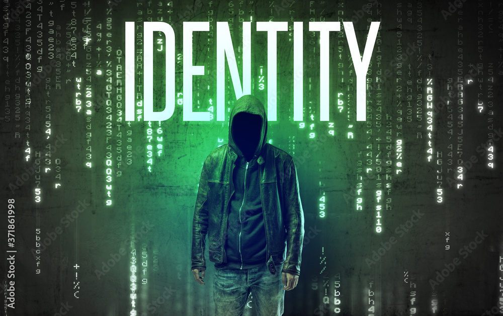 Faceless hacker with IDENTITY inscription, hacking concept Faceless hacker with IDENTITY inscription, hacking concept