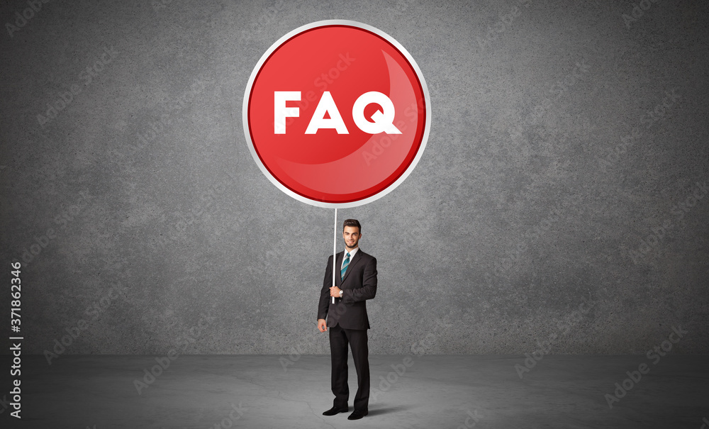 Young business person holdig traffic sign with FAQ abbreviation, technology solution concept Young business person holdig traffic sign with FAQ abbreviation, technology solution concept