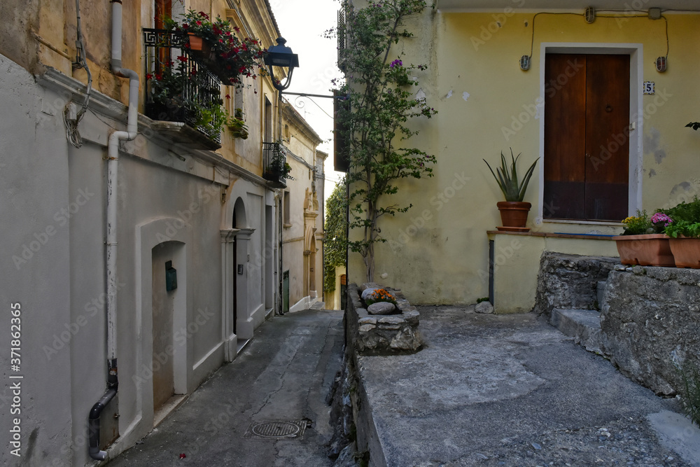 A narrow street between the old houses of San Nicola Arcella, a village in the region of Calabria, Italy.