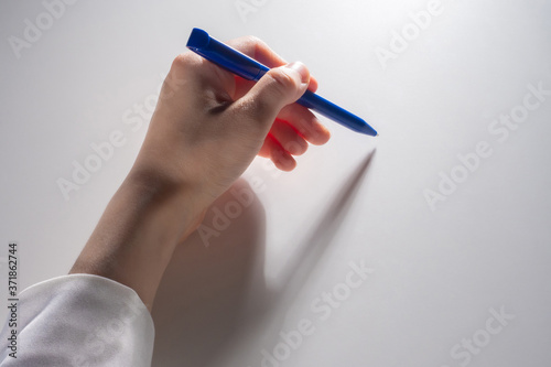 Pen in woman hand. Woman ha...
