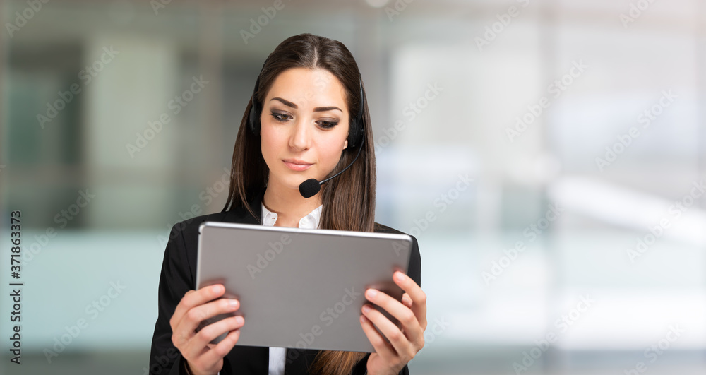Woman remote meeting using a tablet and headset