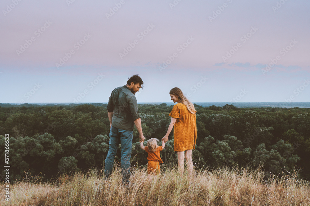 Family parents mother and father with baby holding hands walking outdoor together healthy lifestyle rural nature forest landscape Family parents mother and father with baby holding hands walking outdoor together healthy lifestyle rural nature forest landscape
