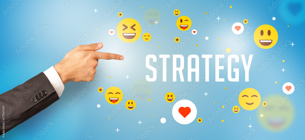 Close-Up of cropped hand pointing at STRATEGY inscription, social media concept Close-Up of cropped hand pointing at STRATEGY inscription, social media concept