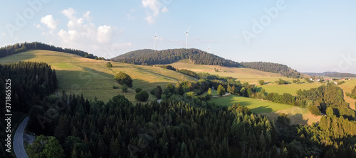 Panorama at sunset from the mountains of the Black Forest near Gersbach over the Wehratal and the city of Wehr towards the Swiss Alps photo