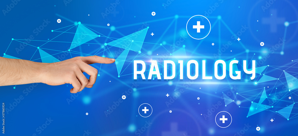 Close-Up of cropped hand pointing at RADIOLOGY inscription, medical concept Close-Up of cropped hand pointing at RADIOLOGY inscription, medical concept