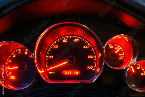 Quadro su tela The glowing red speedometer of a Pontiac G6 with emblems removed.