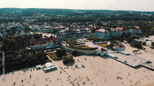 Aerial cityscape of the Sopot, Poland, kuracyjny square and sandy non crowded beach. High quality 4k footage photo