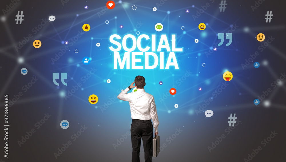 Rear view of a businessman with SOCIAL MEDIA inscription, social networking concept Rear view of a businessman with SOCIAL MEDIA inscription, social networking concept