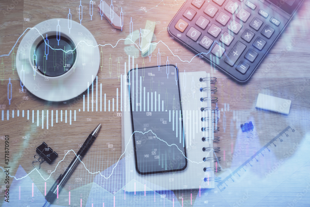 Multi exposure of forex graph hologram over desktop with phone. Top view. Mobile trade platform concept. Multi exposure of forex graph hologram over desktop with phone. Top view. Mobile trade platform concept.