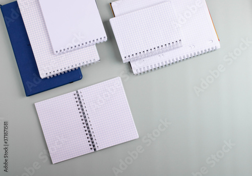 notebooks on mint color background: schooling or office concept