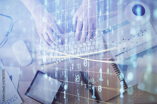 Double exposure of man's hands typing over computer keyboard and data theme hologram drawing. Top view. Technology concept.