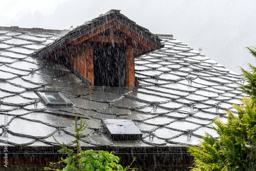 Roof of Courmayeur houses with a view of Mont Blanc - Valle d'Aosta - Italy