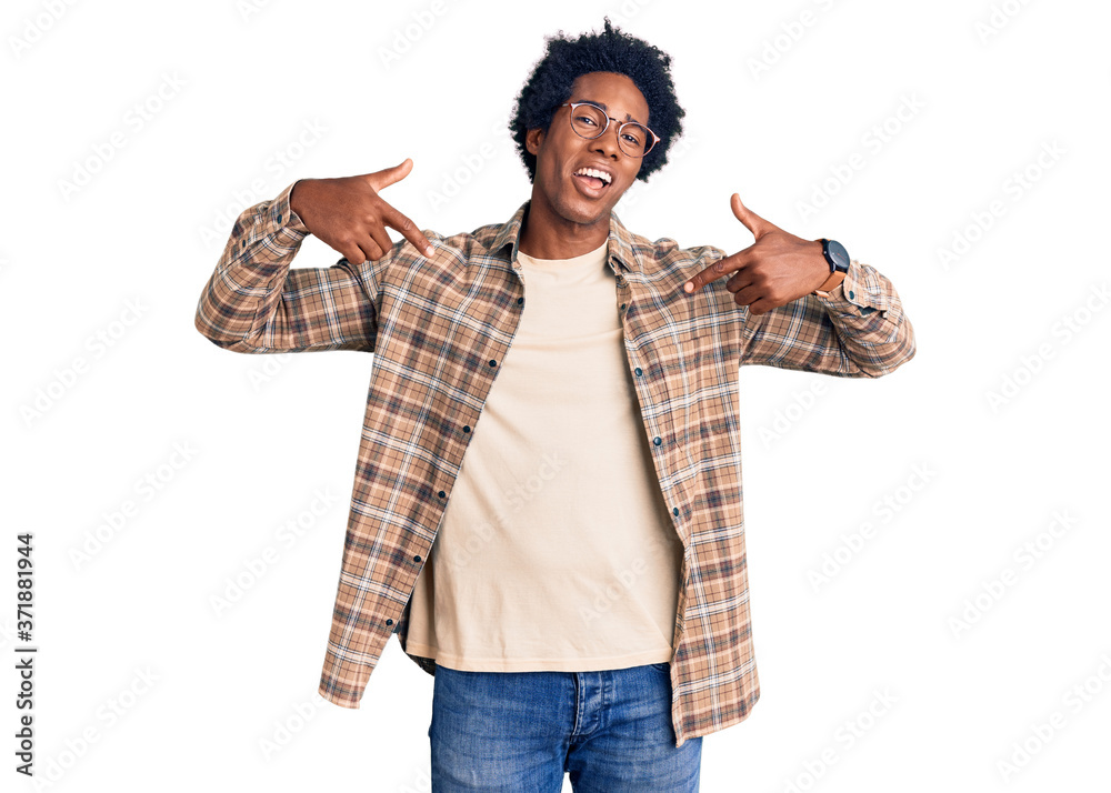 Handsome african american man with afro hair wearing casual clothes and glasses looking confident with smile on face, pointing oneself with fingers proud and happy. Handsome african american man with afro hair wearing casual clothes and glasses looking confident with smile on face, pointing oneself with fingers proud and happy.