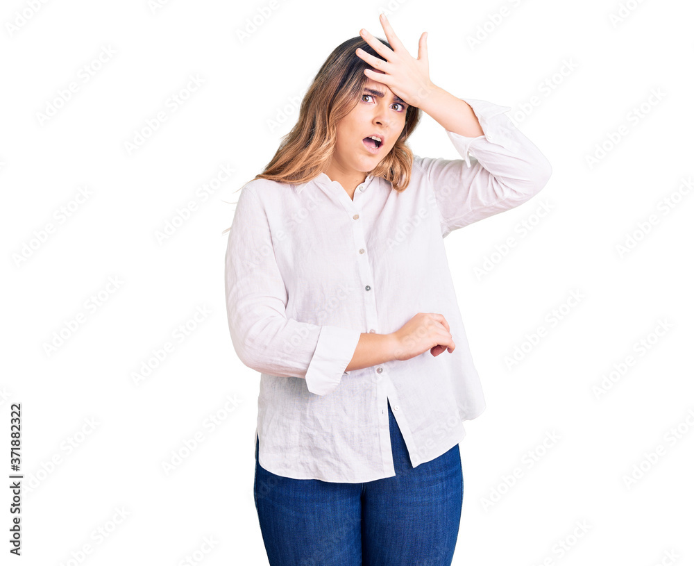 Young caucasian woman wearing casual clothes surprised with hand on head for mistake, remember error. forgot, bad memory concept. Young caucasian woman wearing casual clothes surprised with hand on head for mistake, remember error. forgot, bad memory concept.