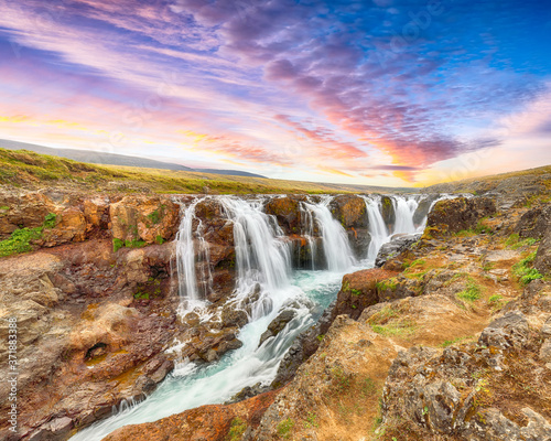 Breathtaking view of  Kolufossar waterfall at sunset.