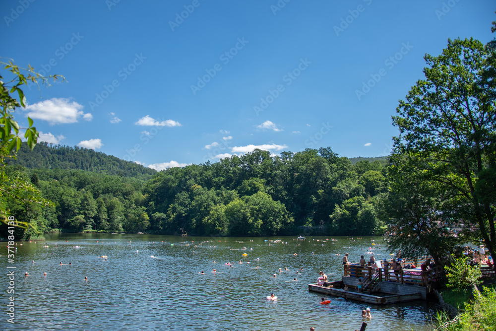 Romania 2020, People enjoying the sunshine on a hot summer day at the Bear Lake Thermal Spa in Sovata, Transylvania, 