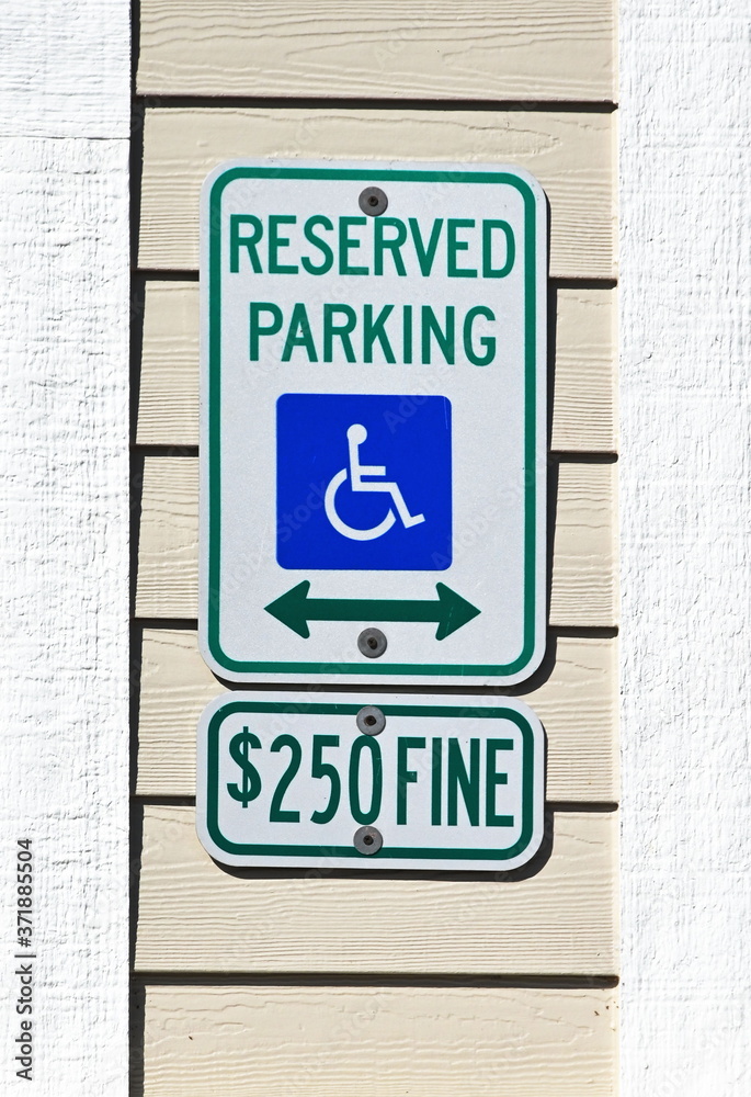Disabled Parking Sign on Building Disabled Parking Sign on Building