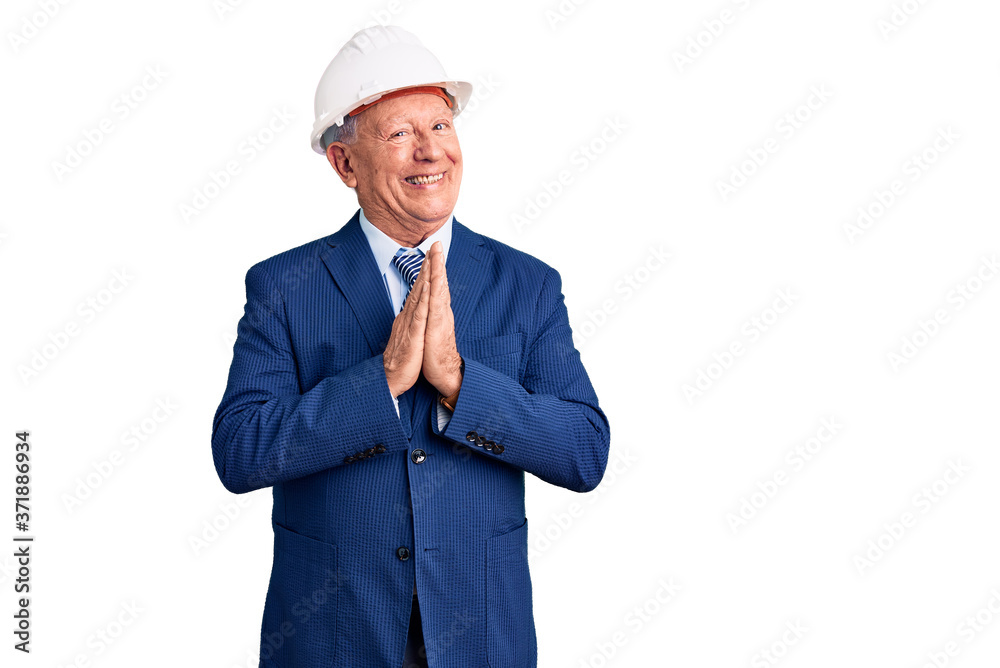 Senior handsome grey-haired man wearing suit and architect hardhat celebrating mad and crazy for success with arms raised and closed eyes screaming excited. winner concept Senior handsome grey-haired man wearing suit and architect hardhat celebrating mad and crazy for success with arms raised and closed eyes screaming excited. winner concept
