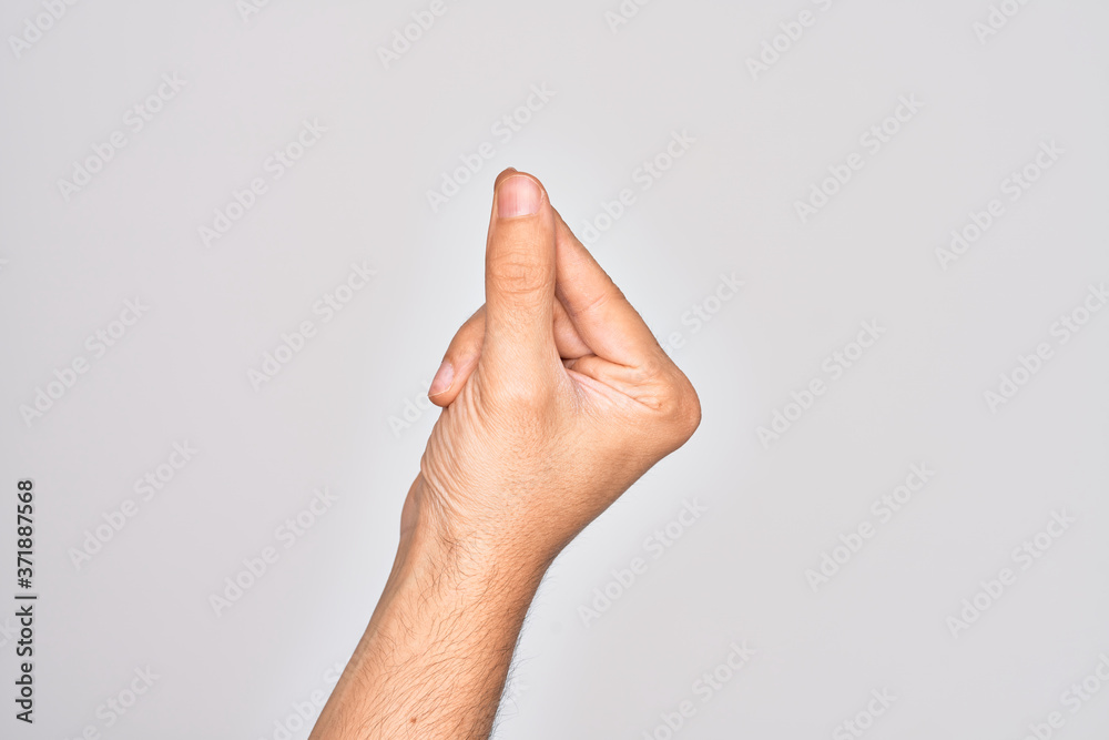 Hand of caucasian young man showing fingers over isolated white background holding blank space with thumb finger, business and advertising Hand of caucasian young man showing fingers over isolated white background holding blank space with thumb finger, business and advertising
