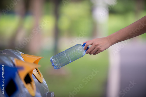 Hand throwing away plastic