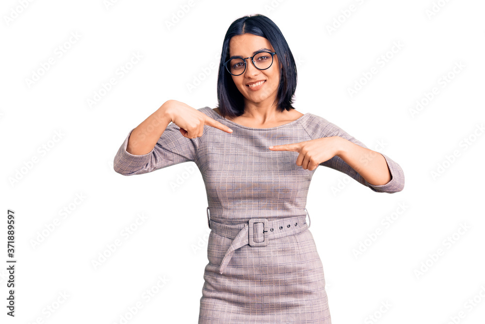 Young beautiful latin woman wearing casual clothes looking confident with smile on face, pointing oneself with fingers proud and happy. Young beautiful latin woman wearing casual clothes looking confident with smile on face, pointing oneself with fingers proud and happy.