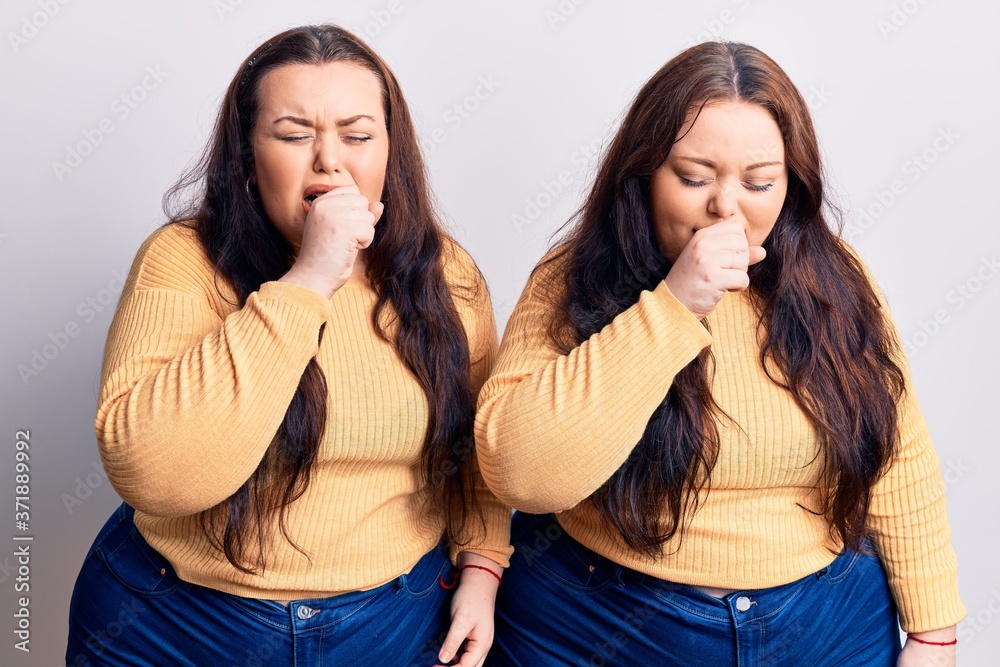 Young plus size twins wearing casual clothes feeling unwell and coughing as symptom for cold or bronchitis. health care concept. Young plus size twins wearing casual clothes feeling unwell and coughing as symptom for cold or bronchitis. health care concept.