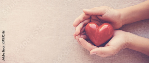 hands holding red heart, health care, love, organ donation, family insurance,CSR,world heart day, world health day, wellbeing, gratitude, be kind,be thankful, praying concept photo