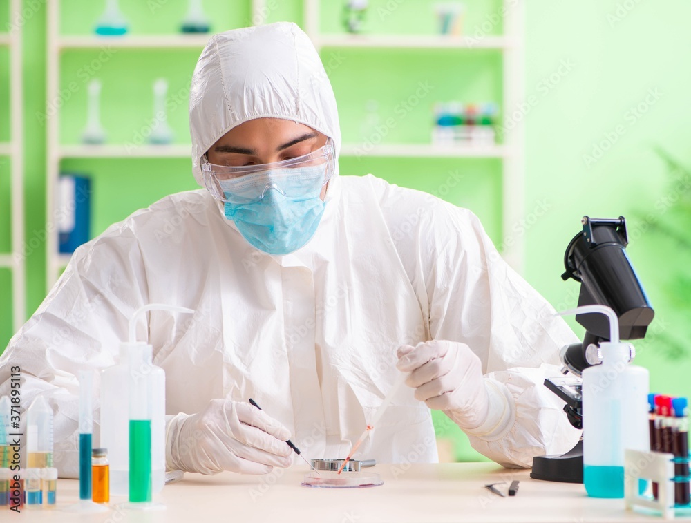 Chemist working in the lab on new experiment Chemist working in the lab on new experiment
