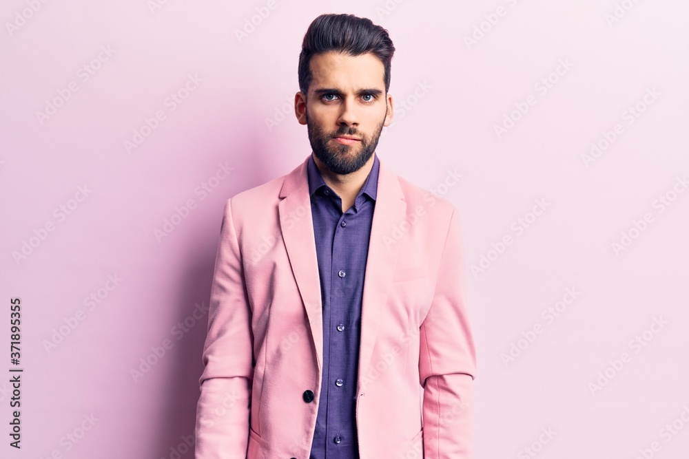 Young handsome man with beard wearing elegant jacket skeptic and nervous, frowning upset because of problem. negative person. Young handsome man with beard wearing elegant jacket skeptic and nervous, frowning upset because of problem. negative person.