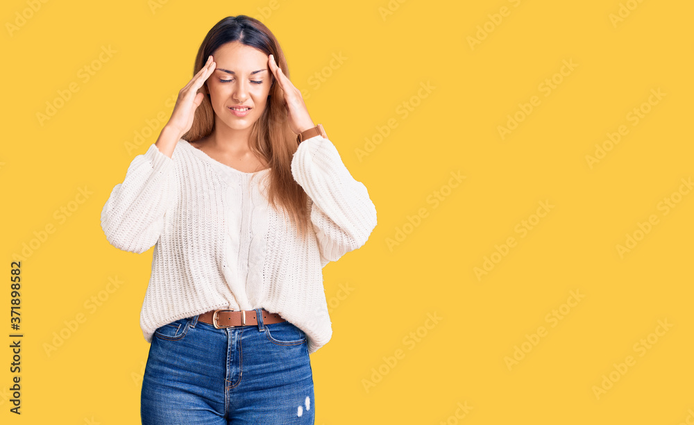 Beautiful young woman wearing casual clothes with hand on head for pain in head because stress. suffering migraine.