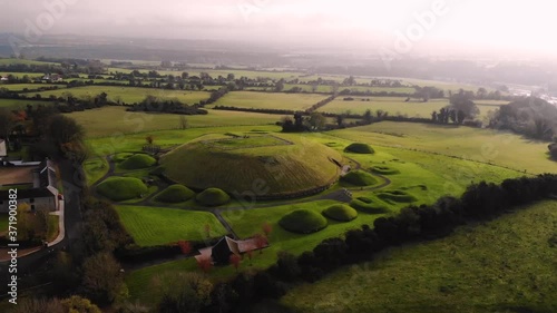 Knowth, Neolithic passage grave aerial orbit shot. Ancient monument located in Ireland. World Heritage site.  photo
